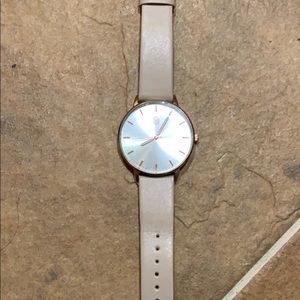 Rose gold and tan watch